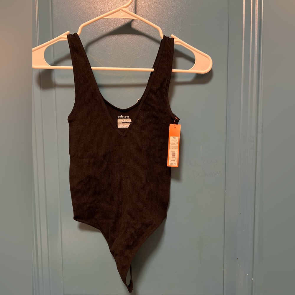 Black bodysuit with a V neckline and open back, made from a lightweight,stretchy